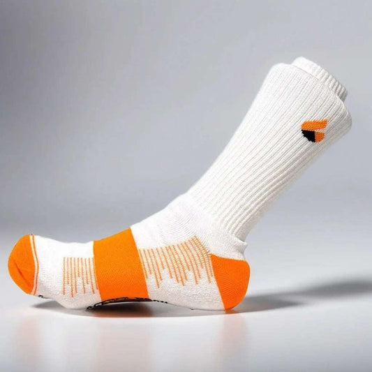 White and orange tennis socks designed for summer performance, providing comfort and ventilation.