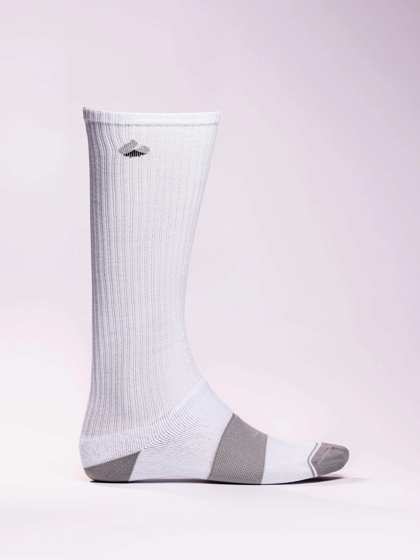 White and grey compression socks made from sustainable bamboo yarn for athletic support and recovery
